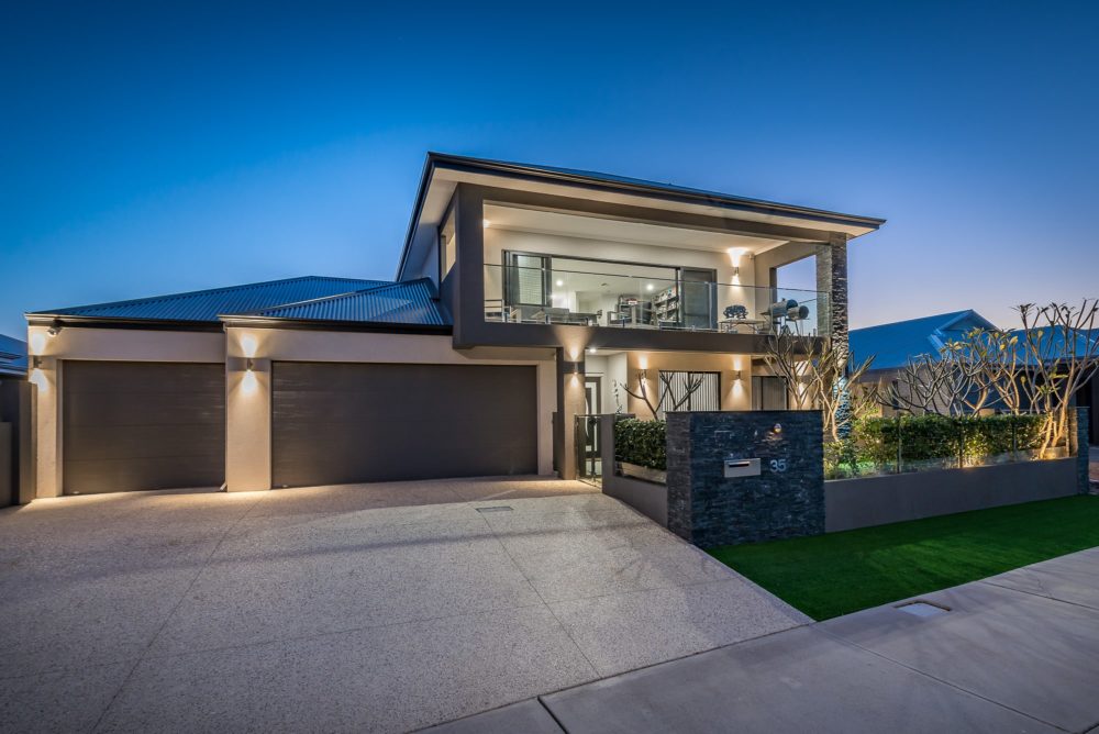 Front of a modern property in Perth at night time.