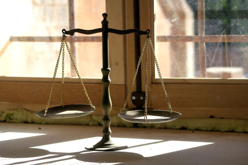 Visual metaphor of balanced decision-making in real estate.