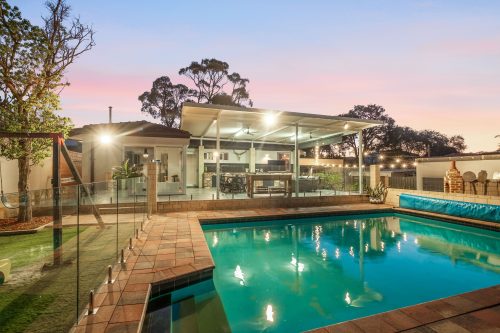Backyard of a house with a pool.