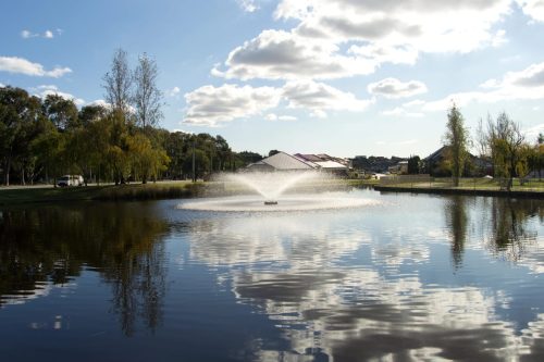 Aveley suburb profile, with fountain in lake.