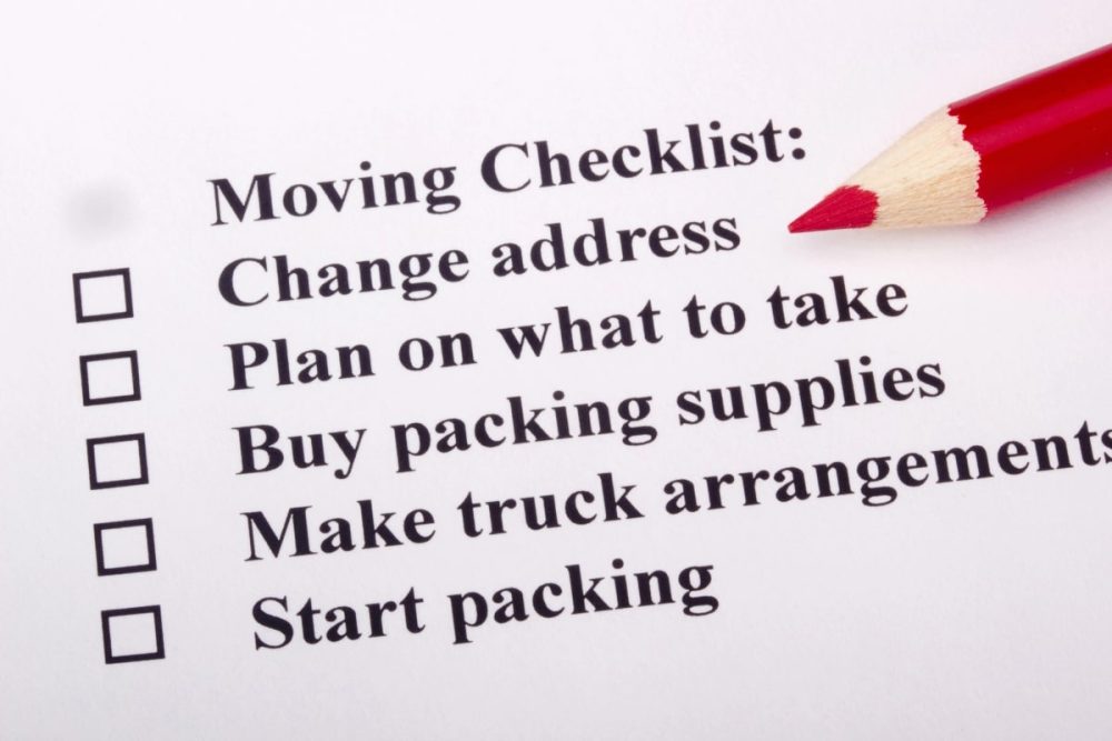 A 'Moving Checklist' showing tips for moving house with a red pencil.