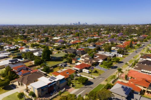 Aerial drone view of Perth suburb and view of skyline.