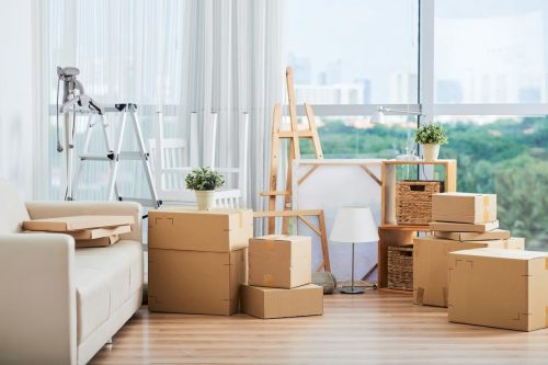Image of packed boxes in a living room, ready for moving house.